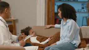 African American mother woman explaining doctor home paramedic symptoms child touch forehead measure temperature nervous worried sickness illness virus pandemic coronavirus unhealthy fever heat unwell - Powered by Shutterstock - Get 15% off with code: PIKWIZARD15