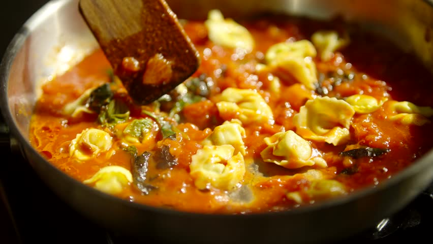 Cooking Homemade Ravioli Pasta. Tortellini Mediterranean Food. Appetizing Meat Ravioli Pasta.Ricotta Tortellini Pasta.Italian Cuisine.  Dumpling Filled Cheese Tortellini.Italian Homemade Pasta Ravioli