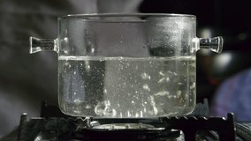 Bubbles Of Boiling Water In Pot. Hot Water Cooking Cookware On Stove. Cooking At Home. Bubbles On Pot Boiling Water And Steam In Kitchen. Cooker Pan. Food Preparation. Hot Temperature Boiling Water - Powered by Shutterstock - Get 15% off with code: PIKWIZARD15