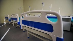 Comfortable hospital ward with modern beds and drawers for patients belongings. Conditions for patients in contemporary children hospital - Powered by Shutterstock - Get 15% off with code: PIKWIZARD15