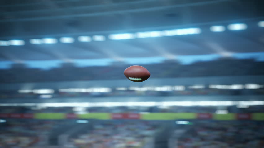 Cinematic Slow-motion Footage of an American Football Ball Flying Across Stadium Scoring Victory Goal. Ball's Trajectory Against a Backdrop of Spectators, Cheering Fans, Repeat TV Screens.