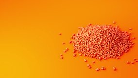 Orange plastic polypropylene granules pouring from cup on a pile of granules, masterbatch polymer grain on orange backdrop. HDPE or PVC resin pellets. 3d render animation. 3D Illustration - Powered by Shutterstock - Get 15% off with code: PIKWIZARD15