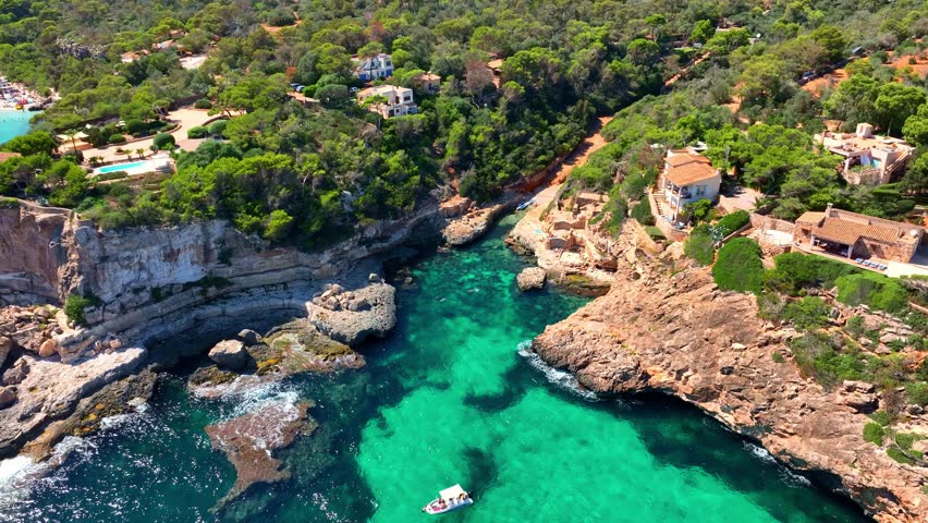 idyllic mediterranean beach on Palma de Mallorca, aerial view of Mallorca coastline, vacation in Spain, holiday on Balearic Islands. High quality 4k footage