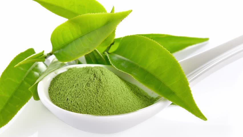 green tea leaves on white background