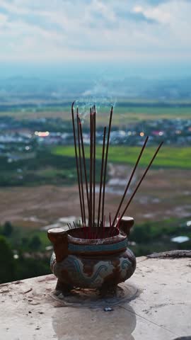 incense sticks smoke on a Buddhist altar on a pagoda in Vietnam in Asia in nature