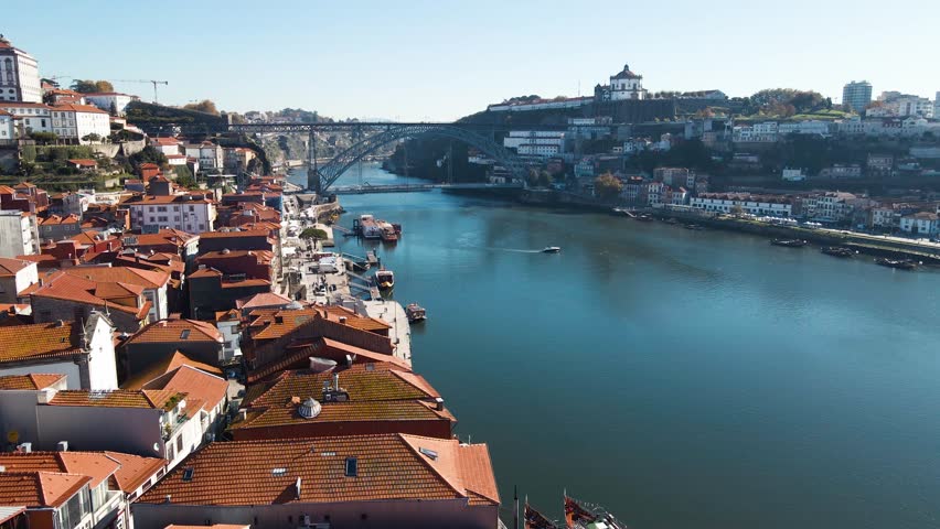 Drone shot of European city Porto with Luis I Bridge over Douro river in Portugal.