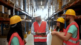 Diverse team of warehouse workers having a discussion in a busy distribution center. The slow motion emphasizes the collaborative atmosphere and attention to detail - Powered by Shutterstock - Get 15% off with code: PIKWIZARD15