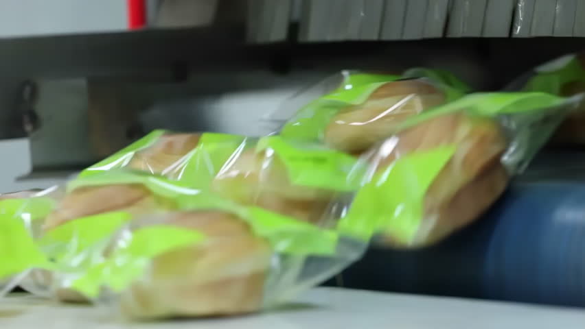 Mass production packaging of pastry gourmet hand-shredded bread products. Factory made packaged croissants. The productions dates last consumption dates are written on the packages. Sweet food concept