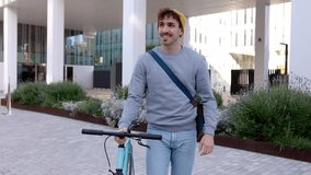Happy young student man walking with bicycle leaving campus college after classes. Education, people and eco friendly transportation concept.  - Powered by Shutterstock - Get 15% off with code: PIKWIZARD15