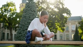 Sad offended worried little girl child schoolgirl kid student primary school abuse problem sit alone outdoors city latino american teenager gen z learner pupil female upset lonely pensive thinking - Powered by Shutterstock - Get 15% off with code: PIKWIZARD15