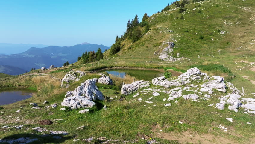 Mountain landscape with meadow and ponds