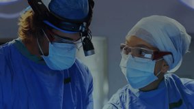 Performing surgery, medical professionals monitoring heart rate with animation. Healthcare, operation, technology - Powered by Shutterstock - Get 15% off with code: PIKWIZARD15