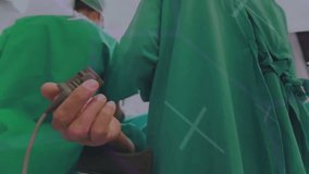 Surgeons in operating room with medical data processing animation overlay. Healthcare, surgery, technology, innovation, teamwork, hospital - Powered by Shutterstock - Get 15% off with code: PIKWIZARD15