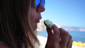 Woman Eating a Slice of Lemon by the Sea - Powered by Shutterstock - Get 15% off with code: PIKWIZARD15