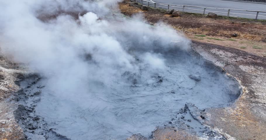 Aerial view of sulfuric smokers hot springs with steam venting in a barren volcanic landscape, Seltun, Iceland.