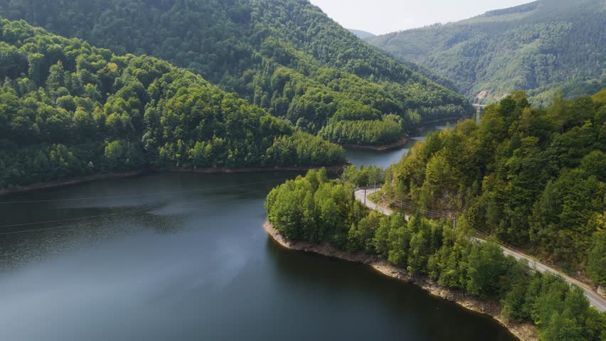 Aerial drone footage of a Oasa Lake from Sureanu mountains, Alba county, Transalpina, Transylvania, Romania.
