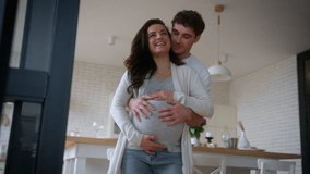 Artificial insemination medicine insurance health happy smiling talking laughing couple at kitchen dancing moving dance man guy male father hugging pregnant woman girl female mother family pregnancy - Powered by Shutterstock - Get 15% off with code: PIKWIZARD15