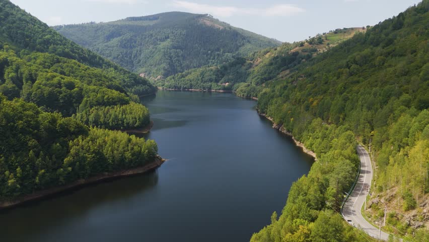 Aerial drone footage of a Oasa Lake from Sureanu mountains, Alba county, Transalpina, Transylvania, Romania.