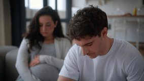 Pregnant couple medical insurance health problem at home man guy angry negative mad furious shouting conflict dissatisfied go away unwanted pregnancy male father woman girl female mother cry suffer - Powered by Shutterstock - Get 15% off with code: PIKWIZARD15