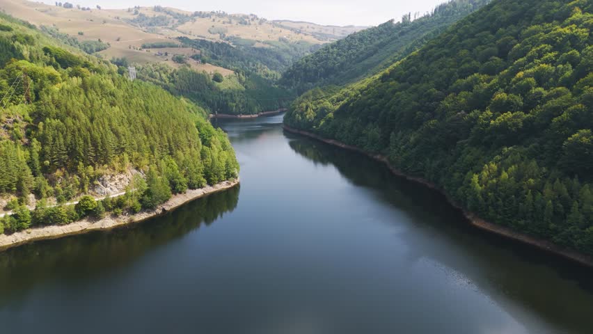 Aerial drone footage of a Oasa Lake from Sureanu mountains, Alba county, Transalpina, Transylvania, Romania.