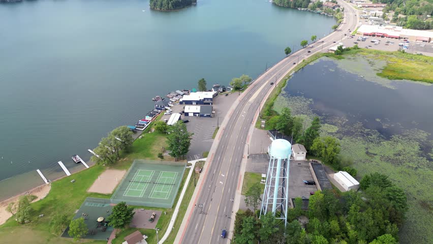 Minocqua Highway (US 51) In Oneida County, Wisconsin. 4K Aerial Tracking Shot Over The Scenic "Island City" Chain Of Lakes In Northern Wisconsin.