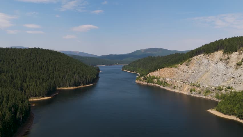 Aerial drone footage of a Oasa Lake from Sureanu mountains, Alba county, Transalpina, Transylvania, Romania. Romanian wild nature and landscape from above. 4K drone footage
