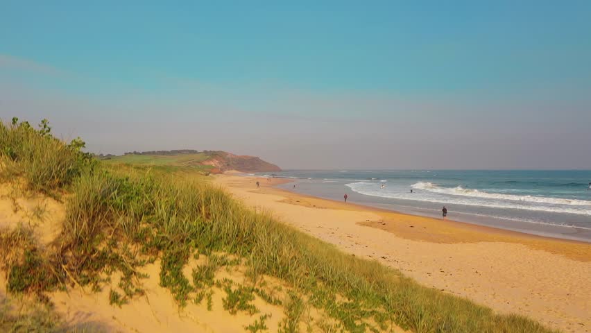 Sunset Sydney Beach Establishing Aerial Shot With Ocean Waves Breaking On Coastline Headland In Background Aerial Video
