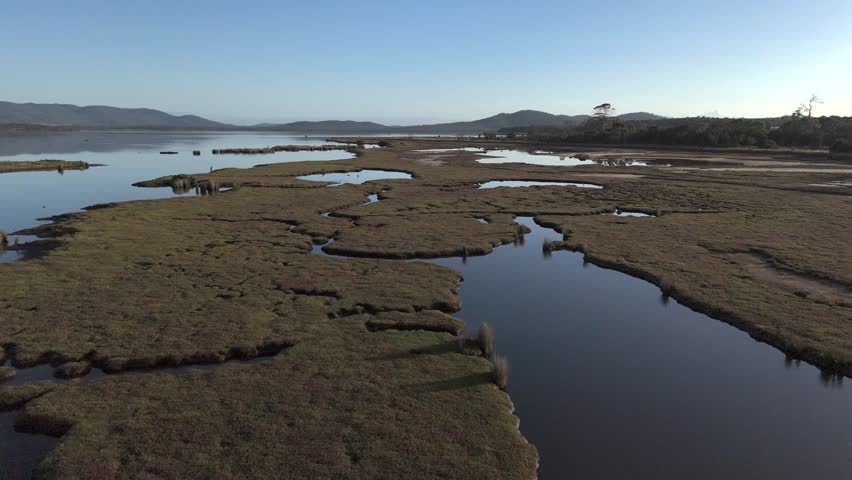Panoramic aerial view over the wetlands of the Moulting Lagoon Game Reserve in Coles Bay, Tasmania.