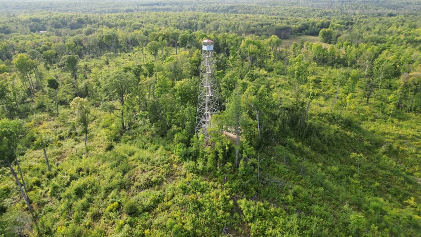 Mountain Fire Lookout Tower In The Nicolet National Forest Of Mountain, Wisconsin. 4K Aerial Zoom In On Staircase Leading Up To The Observation Deck.