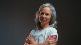 Portrait of proud silver-haired woman after vaccination, covid-19 prevention - Powered by Shutterstock - Get 15% off with code: PIKWIZARD15