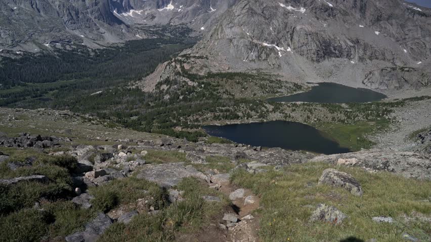 Majestic peaks and rugged terrain surround Lizard Head Peak in the Wind River Wilderness, creating a breathtaking natural view, tilt up