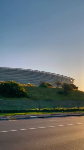 View of Cape Town stadium where the World Cup was hosted in 2010, through the manicured lawns and lush trees of the Metropolitan golf club in Cape Town, South Africa
