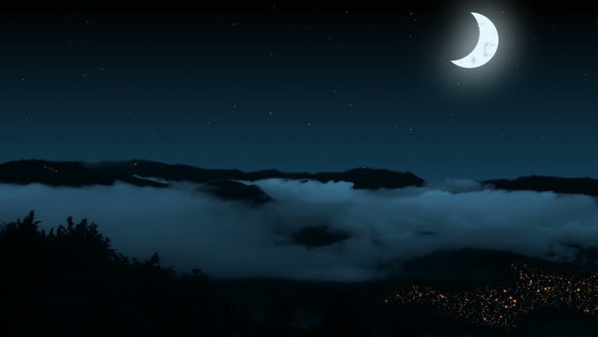 Night. Mountains. The fog between the mountains. Clear skies, the stars and moon