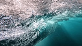 Underwater view of tube wave breaking over coral reef with spinning vortex. powerful nature, strong wave. Abstract bubbles texture, pattern, slow motion 4k. - Powered by Shutterstock - Get 15% off with code: PIKWIZARD15