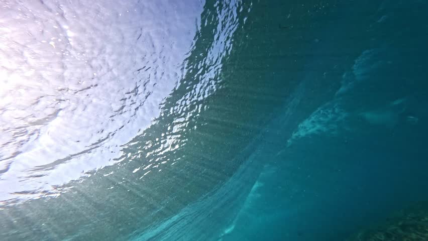 Underwater Hawaii 4k. Glassy ocean tube wave crashing, perfect barrel for surfing. North shore Pipeline famous surfing action sports destination in Oahu island. slow motion. 
