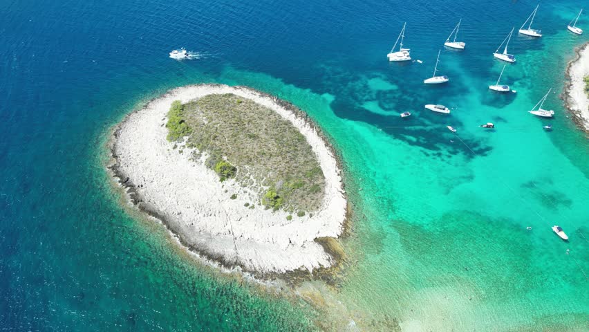 Scenic aerial view of the Paklinski Islands near Hvar, Croatia, surrounded by turquoise waters and yachts anchored along the coast