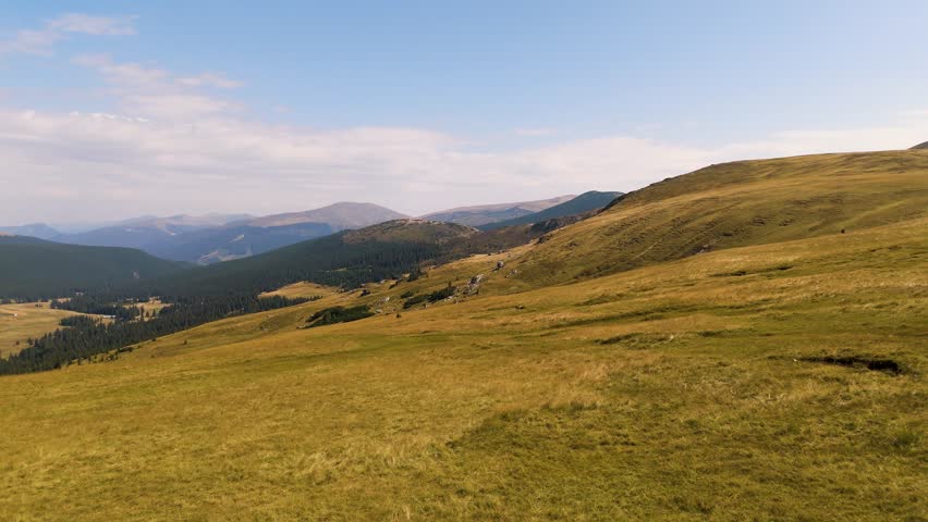 Top cinematic aerial view to the wild Romanian nature and landscape. Transalpina famous destination. Traveling around Romania. 4K drone footage. 