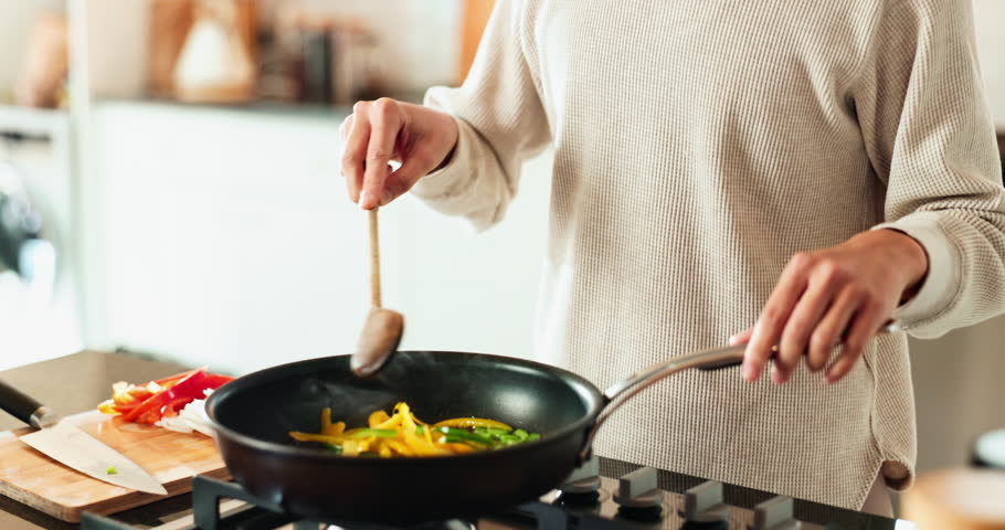 Woman, hands and cooking in kitchen with aroma, vegetables and stirring food in pan. Nutritionist, culinary skills and smelling dish in home for recipe, nutrition and stir fry meal prep for wellness