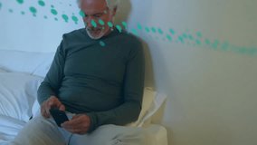 Typing on smartphone, man with gray hair surrounded by floating numbers animation. Technology, texting, communication, data, elderly, connection - Powered by Shutterstock - Get 15% off with code: PIKWIZARD15