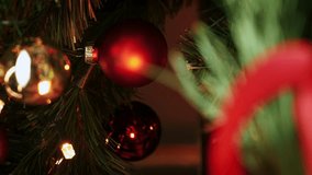 Close up of Christmas tree with colorful balls and illumination. New Year tree lights. Xmas tree decorations background. Vertical video - Powered by Shutterstock - Get 15% off with code: PIKWIZARD15