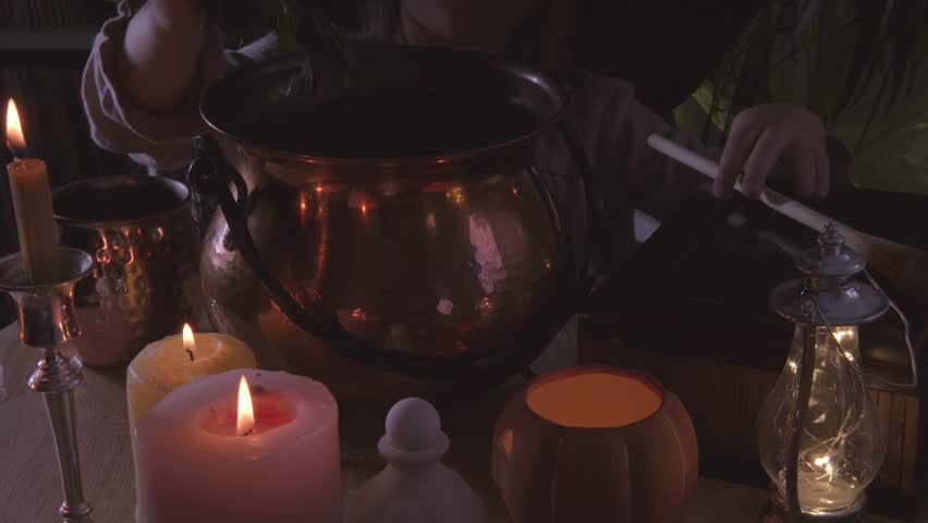 young witch stirs mystical potion in copper cauldron in dark room, adding charm to Halloween party atmosphere, magical potion, whimsical charm, session magic school wizards