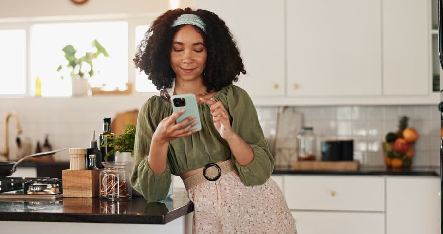 Woman, phone and thinking in kitchen, home and texting with smile, contact and mobile app in morning. Person, girl and smartphone for connection, happy and scroll on social network at apartment