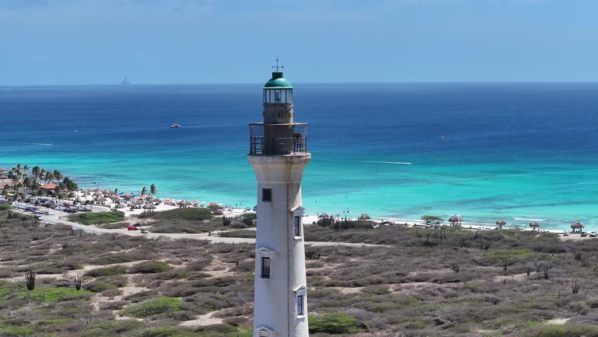 California Lighthouse At Oranjestad Caribbean Netherlands Aruba. Aerial View Of A Landmark Tall Lighthouse In A Coast Beach. Island Life Landscape Grateful Beauty. Summertime Grateful Coast.
