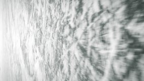 Thick ice with deep cracks, close up of ice. Ice skating. Frozen lake with ice. Figure skating. Winter outdoor sport activity. Vertical video - Powered by Shutterstock - Get 15% off with code: PIKWIZARD15