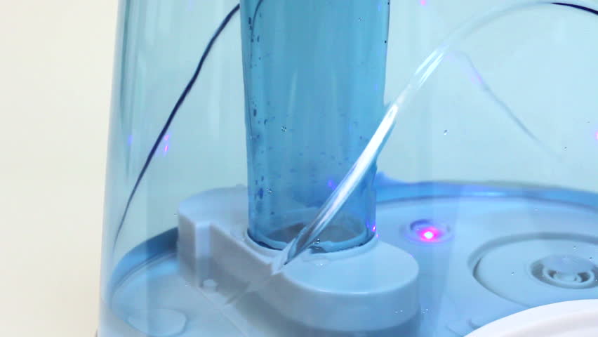 Air humidifier. Steam evaporation. Water drops on its surface.