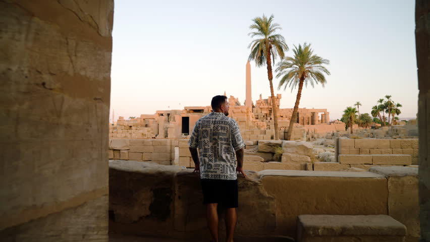 Tourist Exploring Karnak Temple Complex Sights In Thebes, Luxor, Egypt. Tracking Shot - Powered by Shutterstock - Get 15% off with code: PIKWIZARD15