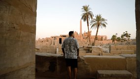Tourist Exploring Karnak Temple Complex Sights In Thebes, Luxor, Egypt. Tracking Shot - Powered by Shutterstock - Get 15% off with code: PIKWIZARD15