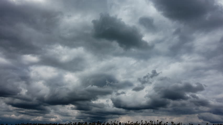 Storm Clouds Moving in Time Lapse with Cloudy Landscape with Summer Rain Over Sunflower Field. Motion Clouds and Global Warming Concept. Nature Environment with Thunderstorm Weather. Dramatic Sky