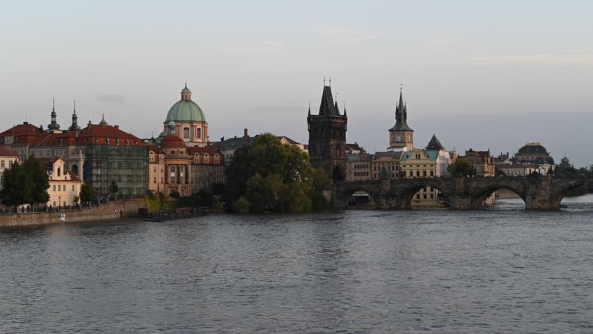 Time lapse video evening view of the iconic Charles Bridge over Vltava river and Prague Old town cityscape, in Prague, Czech Republic