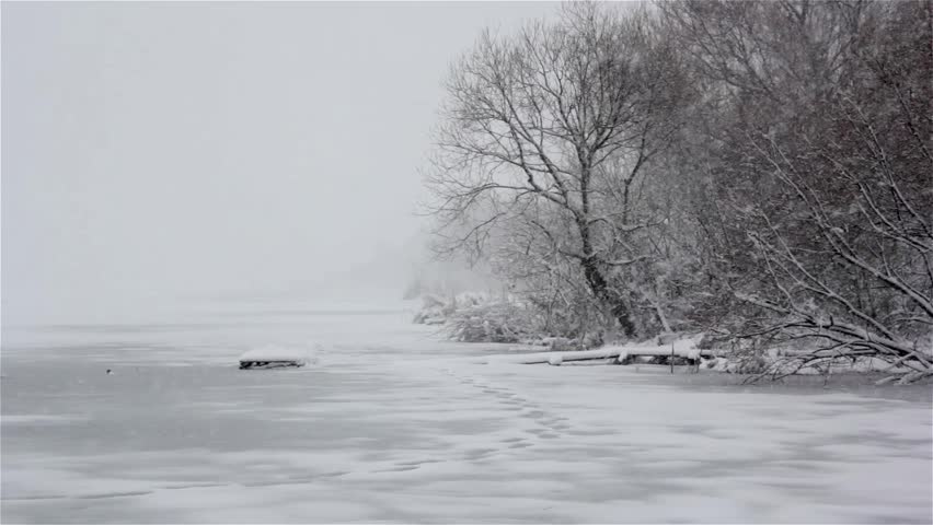Heavy Snowfall Lake-Effect Snow,reflection of trees in winter river